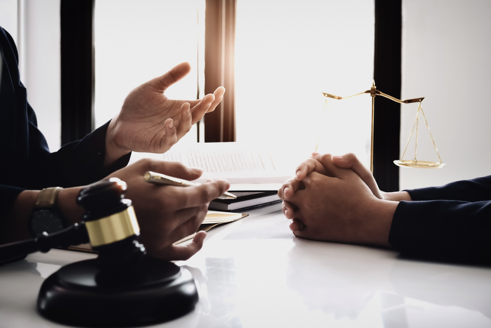 judge gavel with client consult lawyer lawsuit bankruptcy of her