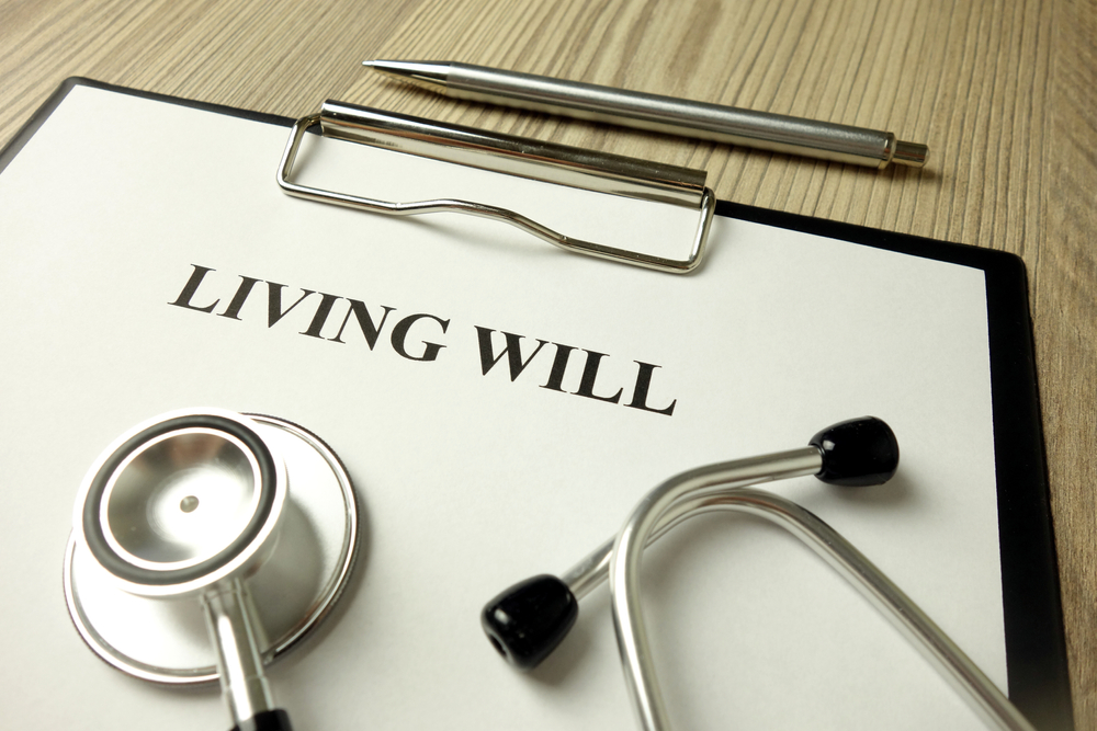living will directive with stethoscope and pen