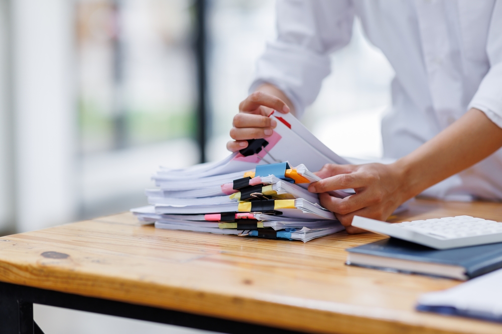 Business Documents, Auditor businesswoman checking searching document legal prepare paperwork or report for analysis TAX time